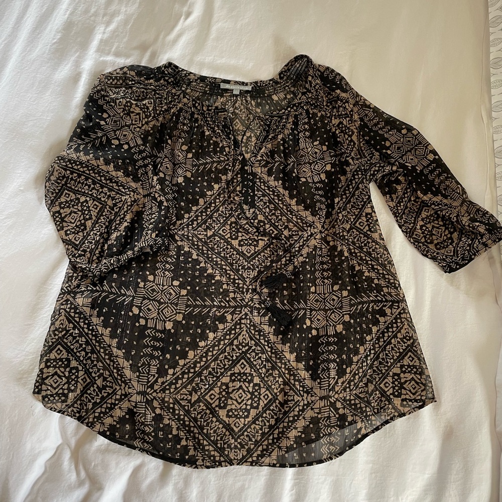 Sheer blouse in black and gold.